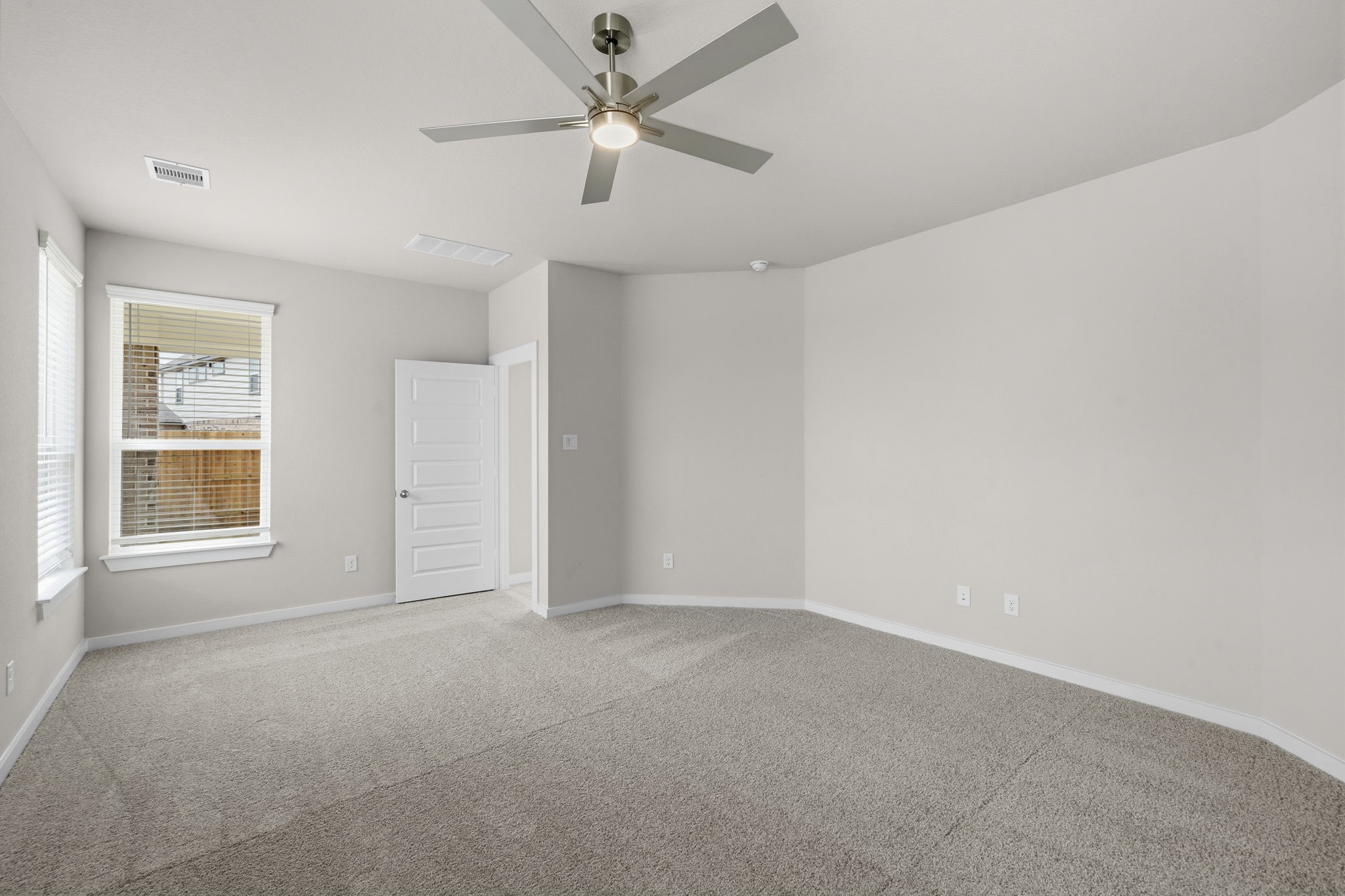 4017 Sun Burst Lane Brookshire, TX 77423 - Photo 14 of 49 an empty room with a window and a fan