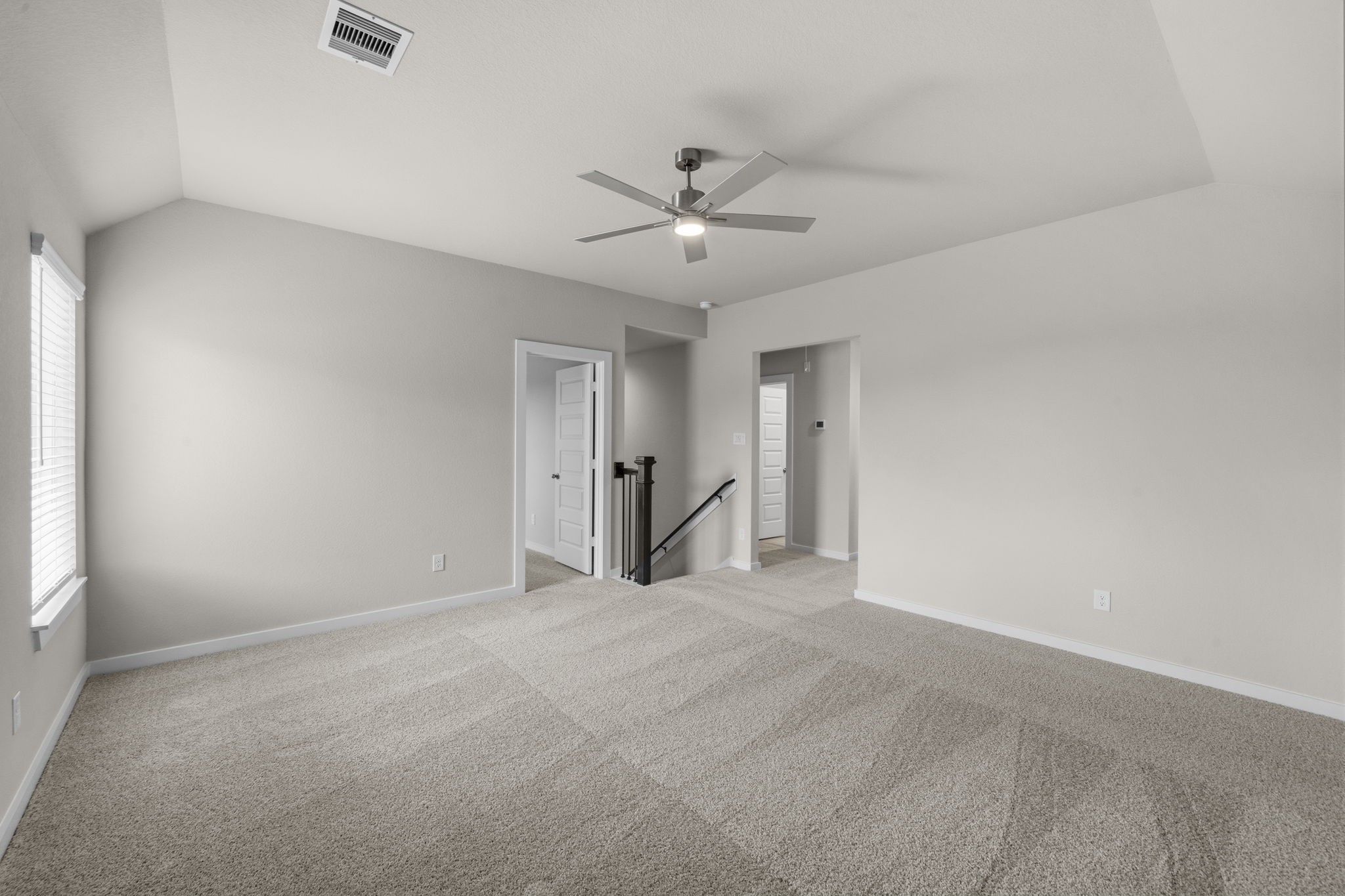 4017 Sun Burst Lane Brookshire, TX 77423 - Photo 19 of 49 a view of an empty room with a ceiling fan