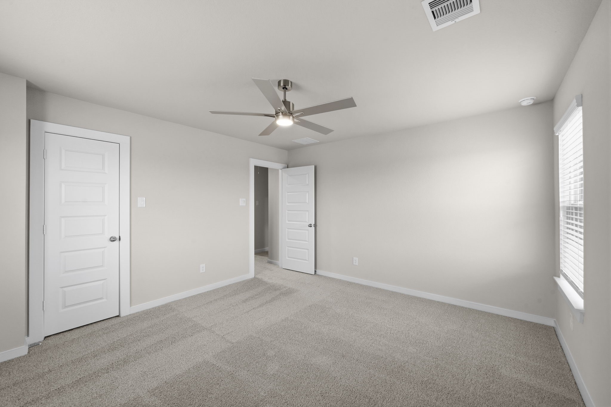 4017 Sun Burst Lane Brookshire, TX 77423 - Photo 21 of 49 an empty room with windows and fan