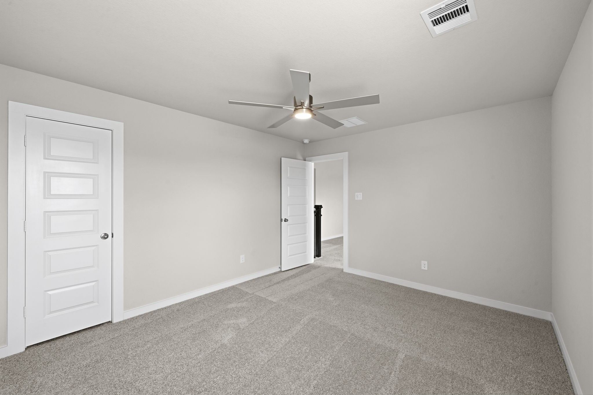 4017 Sun Burst Lane Brookshire, TX 77423 - Photo 27 of 49 an empty room with a ceiling fan and a window