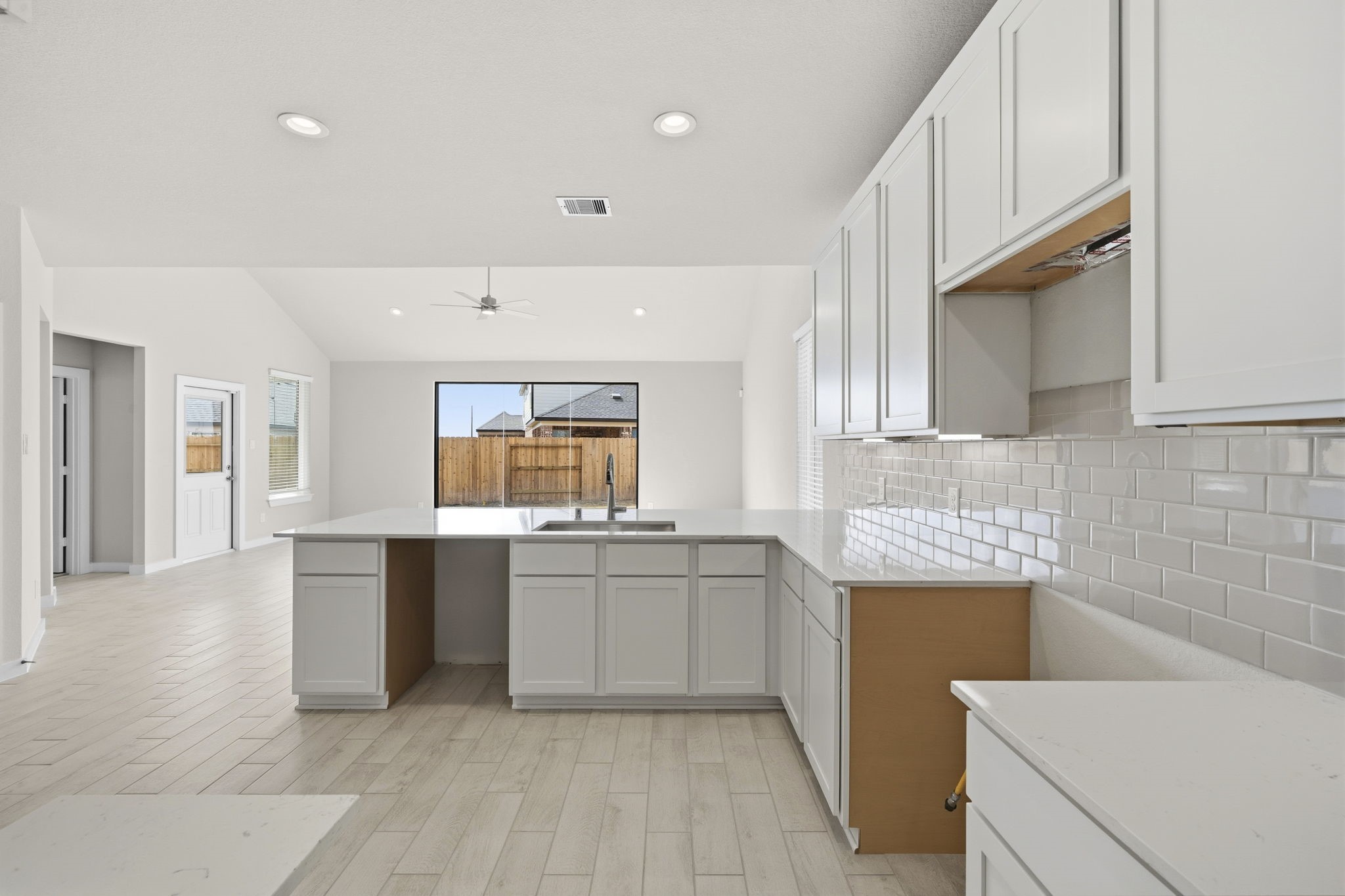 4017 Sun Burst Lane Brookshire, TX 77423 - Photo 4 of 49 a kitchen with granite countertop a sink stove and cabinets