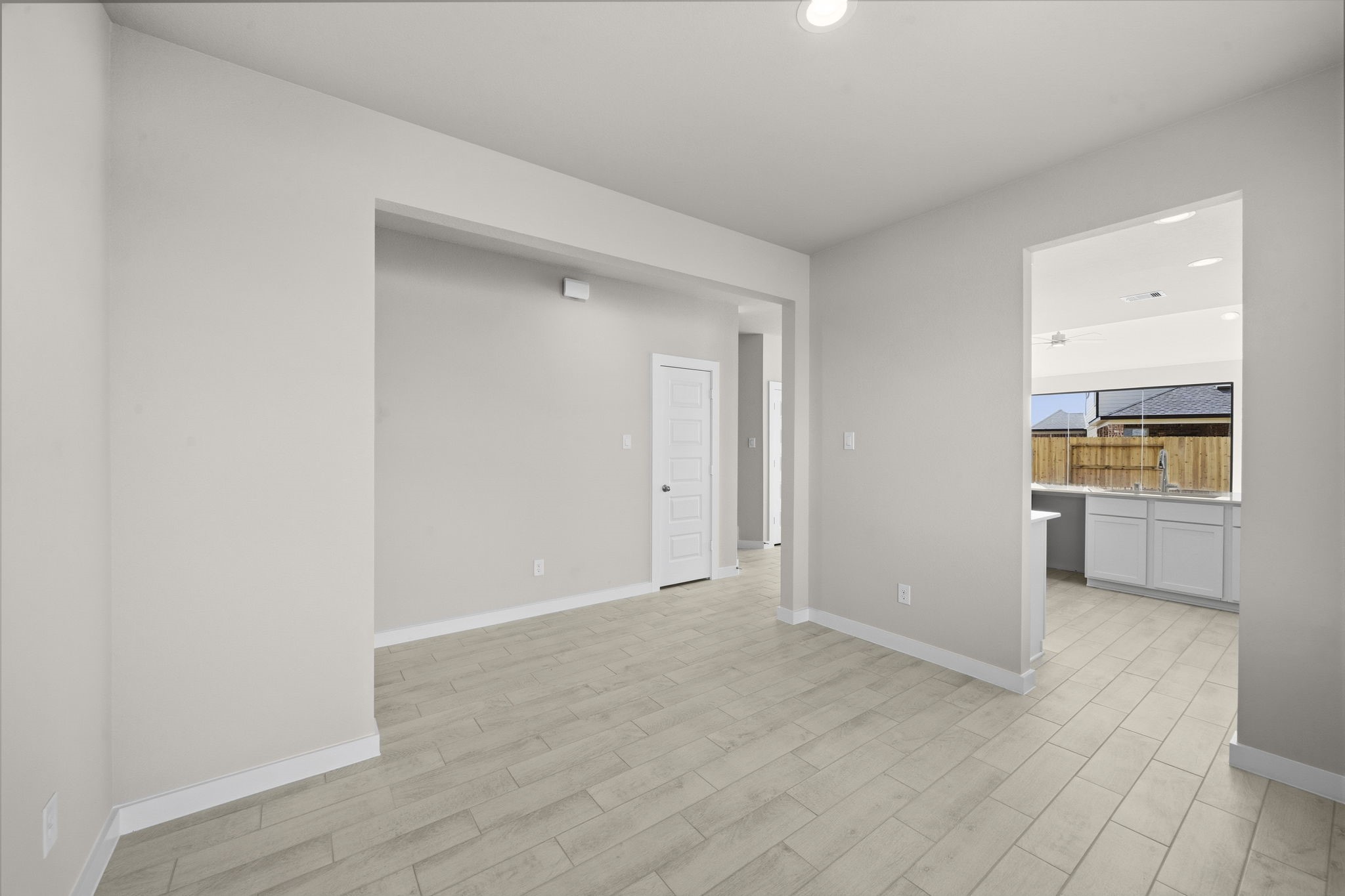 4017 Sun Burst Lane Brookshire, TX 77423 - Photo 7 of 49 a view of a kitchen with refrigerator and wooden floor