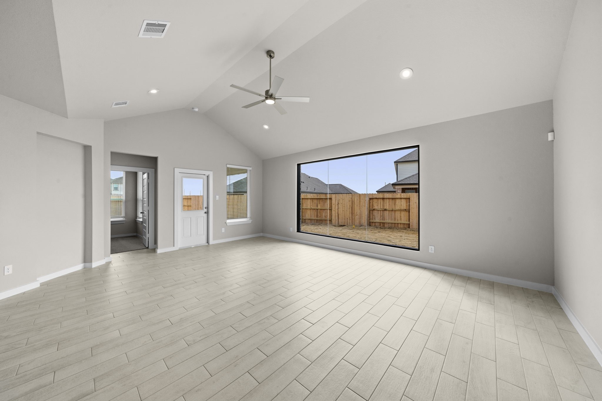 4017 Sun Burst Lane Brookshire, TX 77423 - Photo 9 of 49 a view of an empty room with window and wooden floor