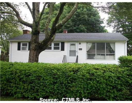 a house that has a tree in front of it