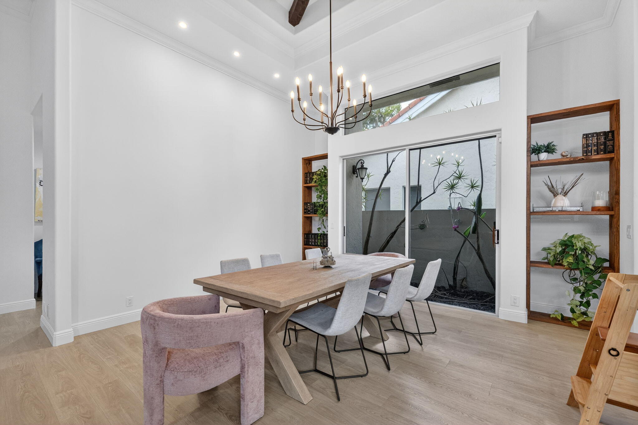 7450 Campo Florido Boca Raton, FL 33433 - Photo 12 of 63 a view of a dining room with furniture a chandelier and wooden floor