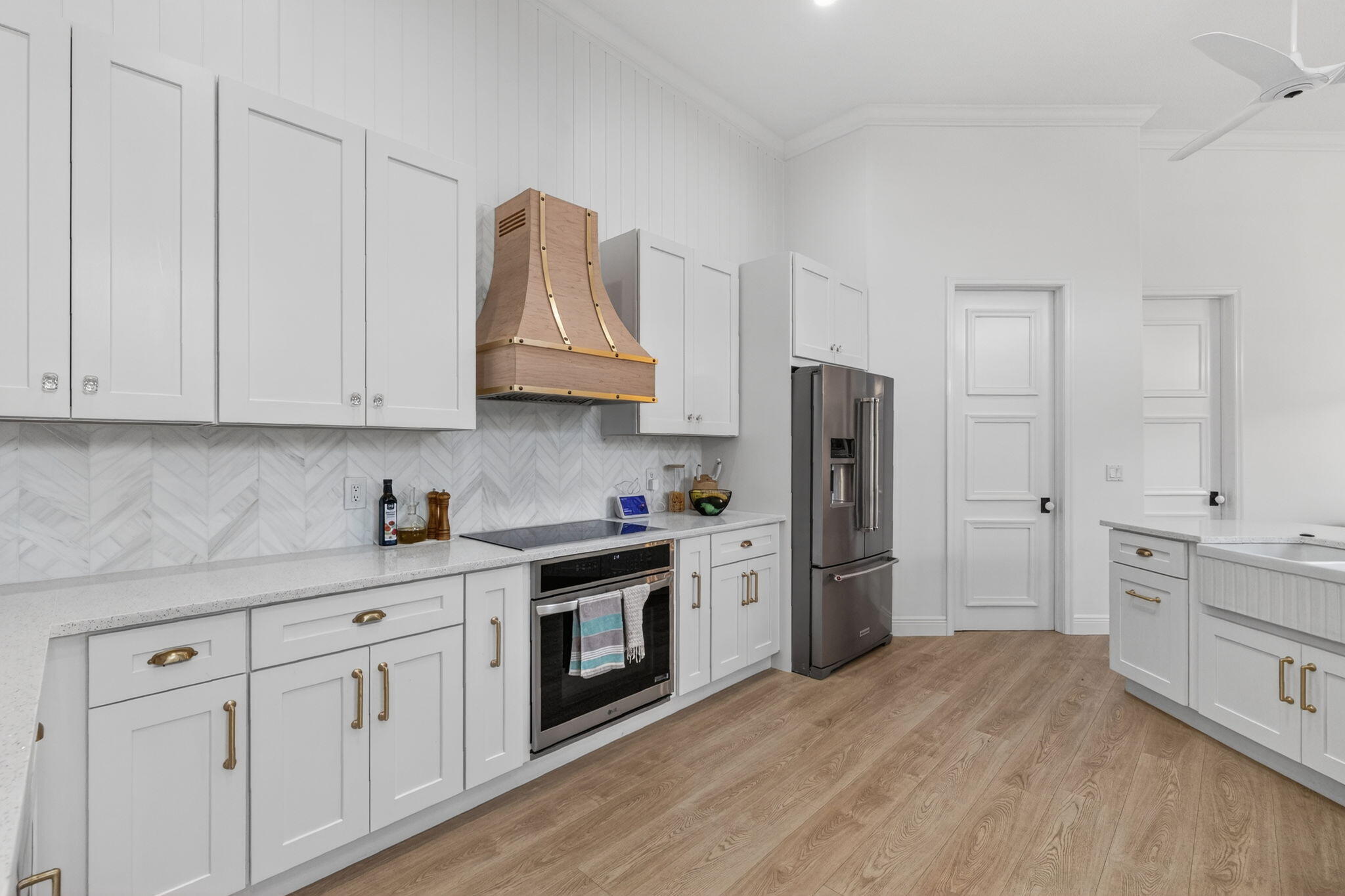 7450 Campo Florido Boca Raton, FL 33433 - Photo 16 of 63 a kitchen with stainless steel appliances granite countertop a refrigerator sink and stove with white cabinets