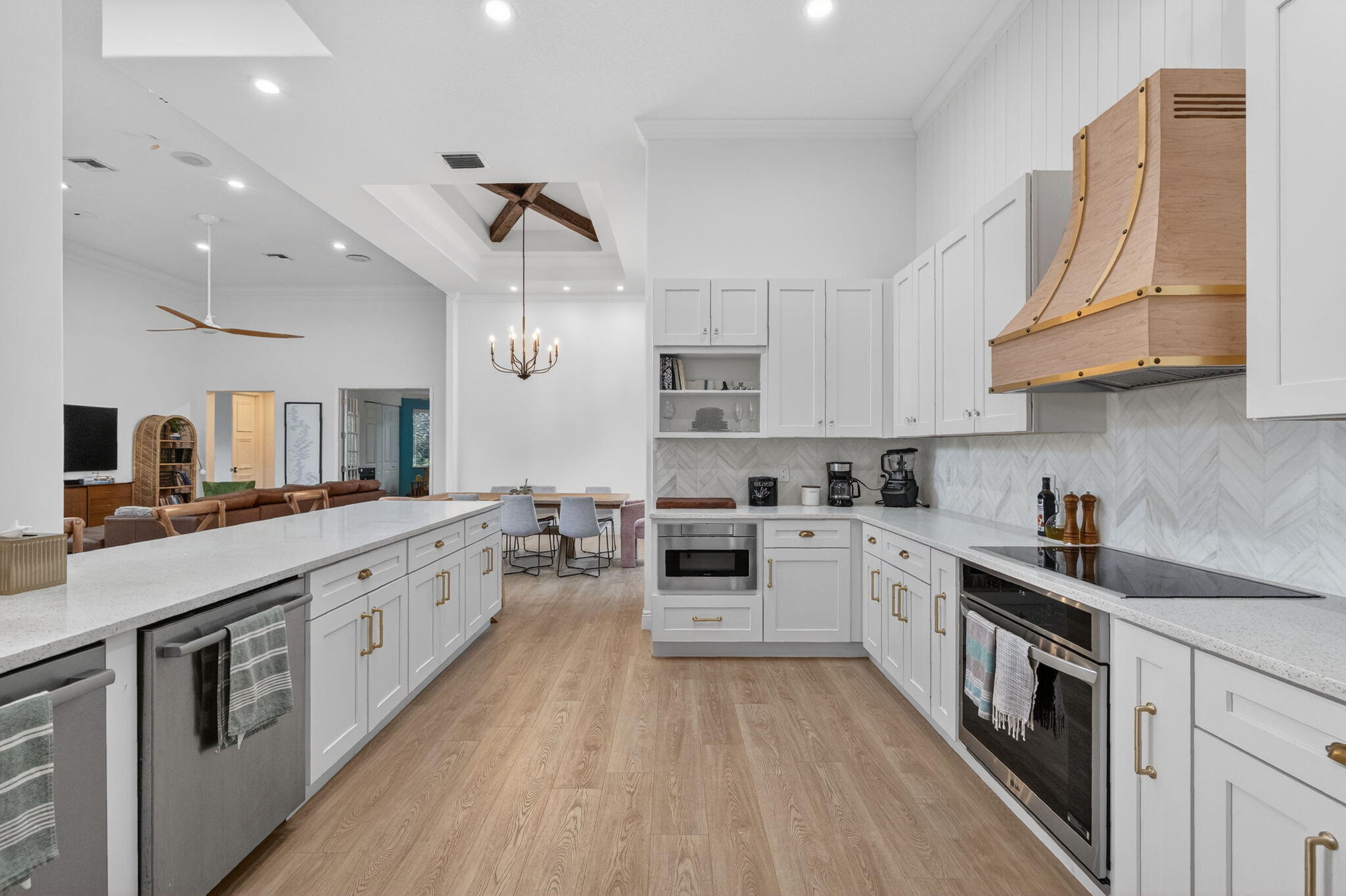 7450 Campo Florido Boca Raton, FL 33433 - Photo 18 of 63 a large kitchen with stainless steel appliances granite countertop a lot of counter space and wooden floors