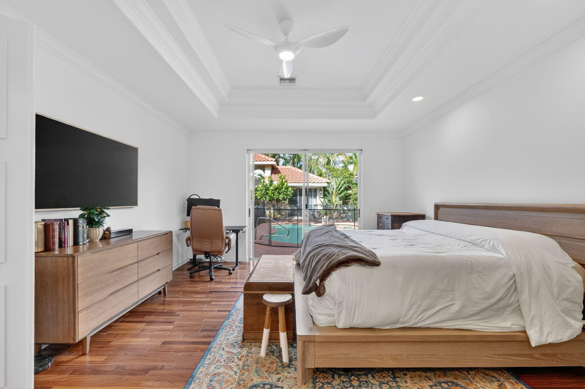 7450 Campo Florido Boca Raton, FL 33433 - Photo 24 of 63 a living room with a bed furniture flat screen tv and a large window