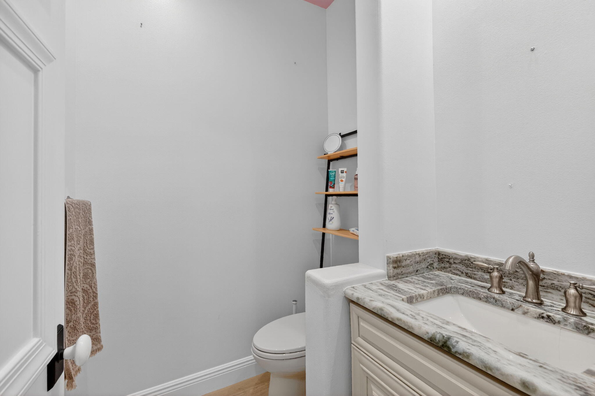 7450 Campo Florido Boca Raton, FL 33433 - Photo 30 of 63 a bathroom with a granite countertop sink a toilet and a mirror