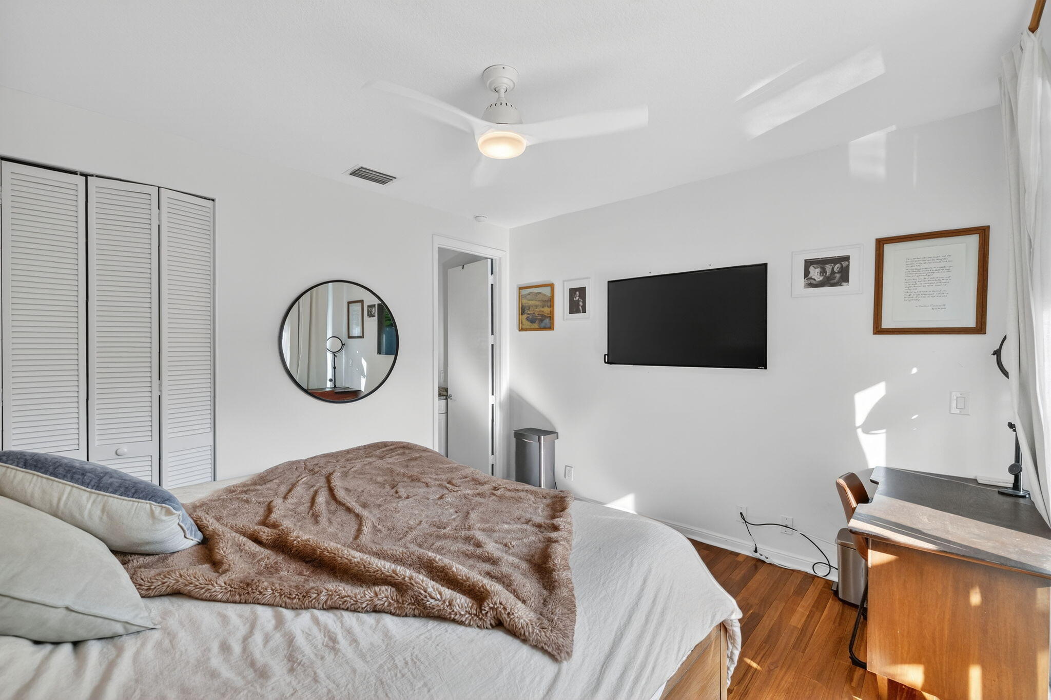 7450 Campo Florido Boca Raton, FL 33433 - Photo 41 of 63 a bedroom with a bed and a flat screen tv