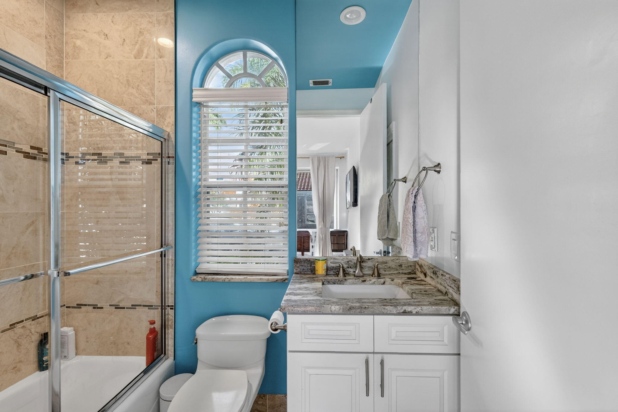 7450 Campo Florido Boca Raton, FL 33433 - Photo 43 of 63 a bathroom with a granite countertop sink toilet and shower