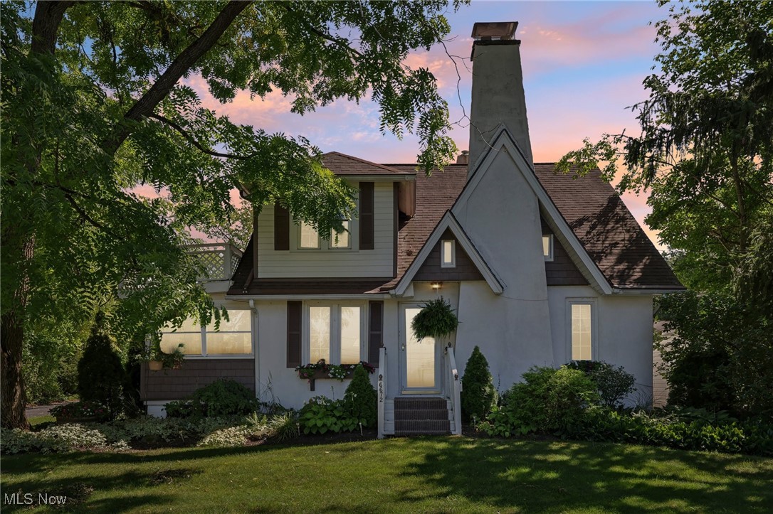 View of front of home with a yard
