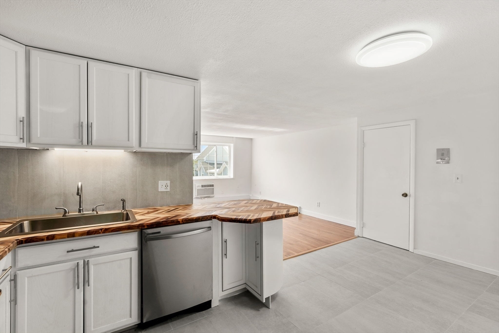 15 Staples Avenue, Unit 41 Everett, MA 02149 - Photo 2 of 9 a kitchen with a sink and cabinets