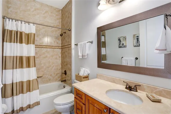 a bathroom with a sink a toilet and a bathtub