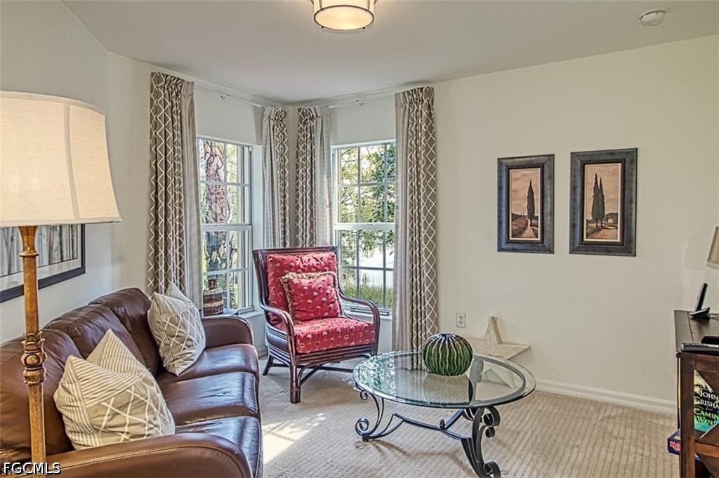 10072 Oakhurst Way Fort Myers, FL 33913 - Photo 11 of 26 a living room with furniture and a window
