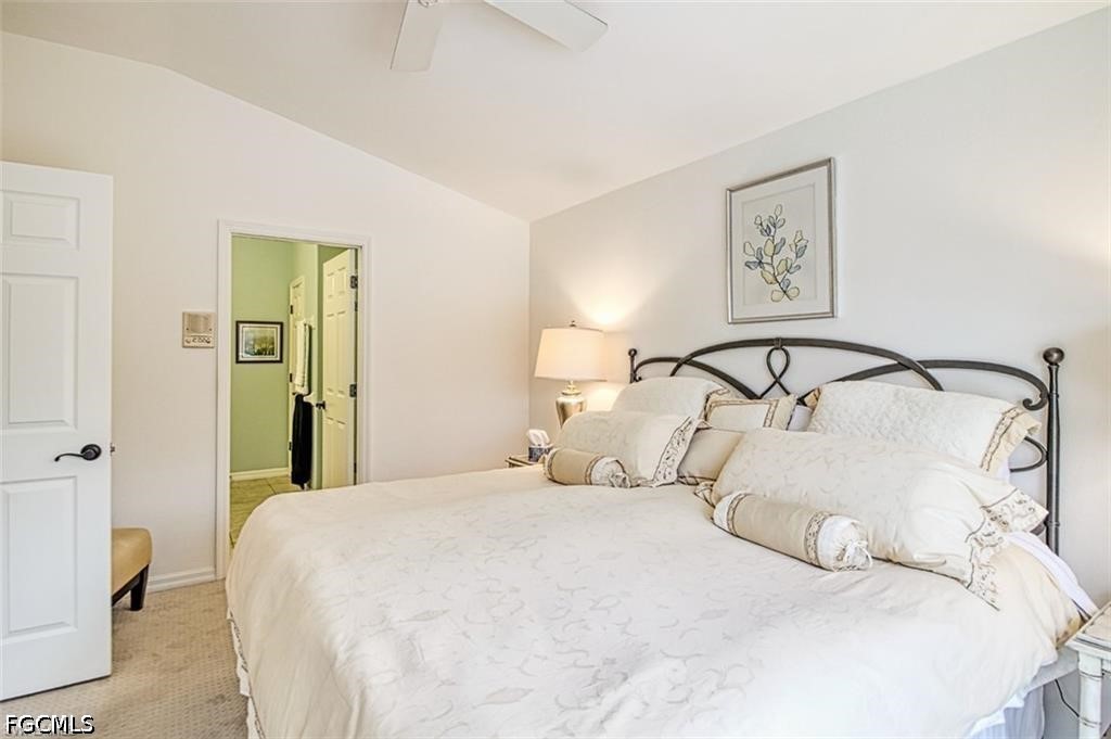 10072 Oakhurst Way Fort Myers, FL 33913 - Photo 14 of 26 a bedroom with a bed and painting on the wall