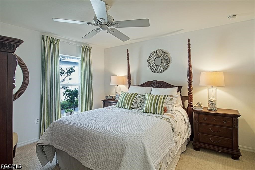 10072 Oakhurst Way Fort Myers, FL 33913 - Photo 17 of 26 a bedroom with a bed and a window