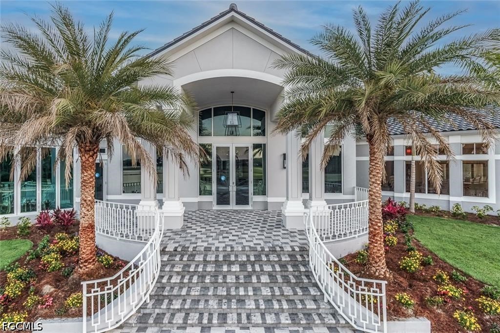 10072 Oakhurst Way Fort Myers, FL 33913 - Photo 23 of 26 a front view of a house with garden