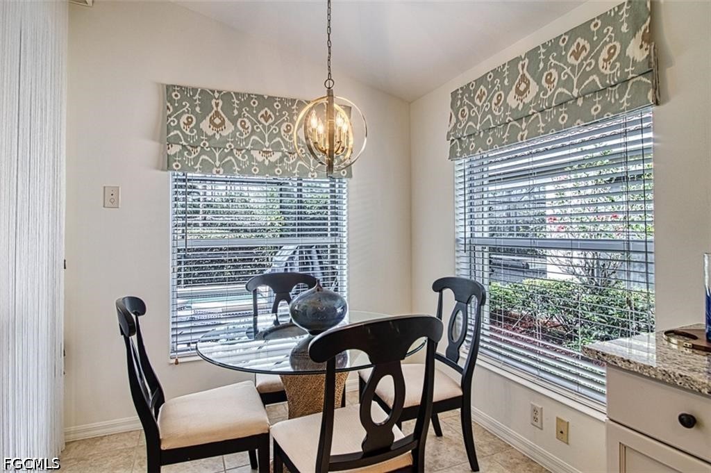 10072 Oakhurst Way Fort Myers, FL 33913 - Photo 9 of 26 a view of a dining room with furniture and chandelier