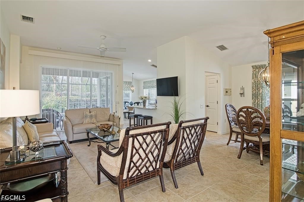 10072 Oakhurst Way Fort Myers, FL 33913 - Photo 10 of 26 a living room with furniture and a flat screen tv