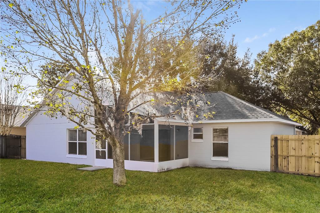 3007 East Beaumont Lane Eustis, FL 32726 - Photo 15 of 16 a front view of house with yard and green space