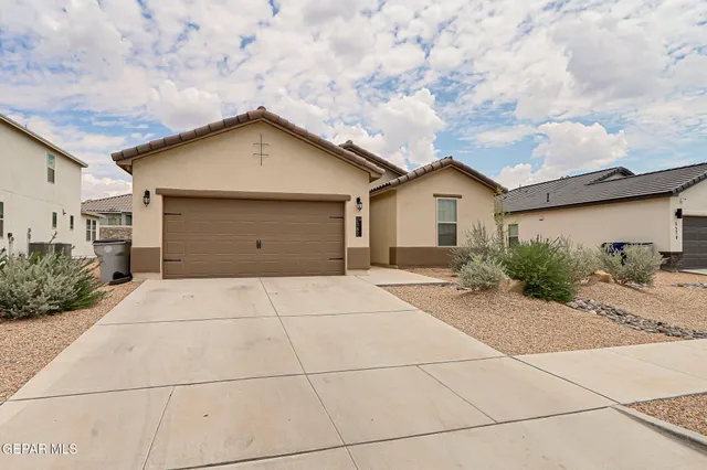 a view of garage and yard
