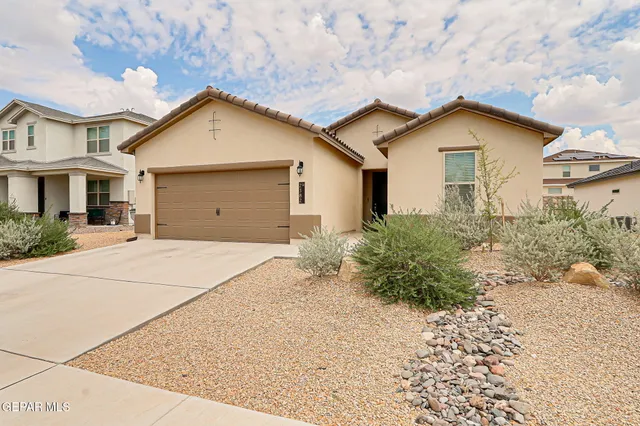 a view of garage yard and tree