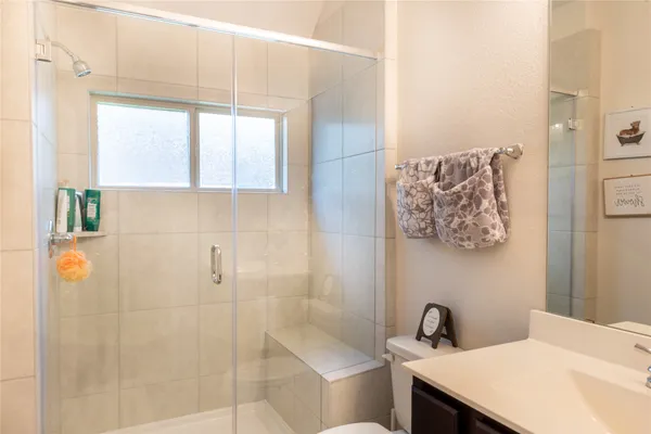 a bathroom with a sink and a shower