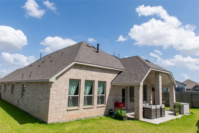 a view of a house with yard porch and furniture