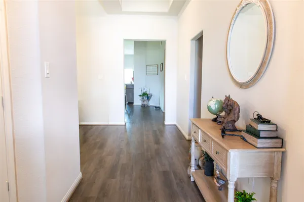 a view of a living room and a mirror