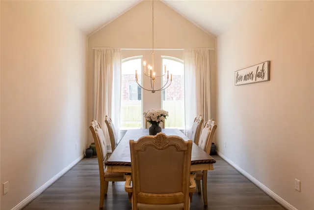 a dining room with furniture and window