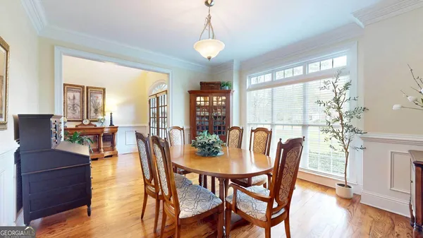 a view of a dining room with furniture window and wooden floor