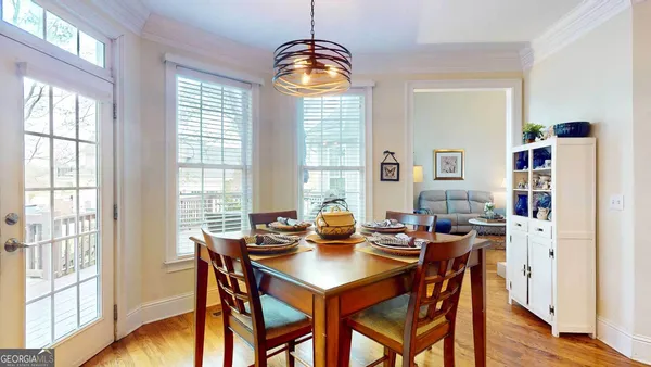 a view of a dining room with furniture window and wooden floor