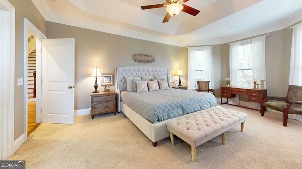 a bathroom with a tub sink and a mirror