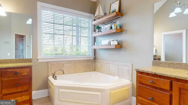 a view of kitchen with wooden floor and electronic appliances