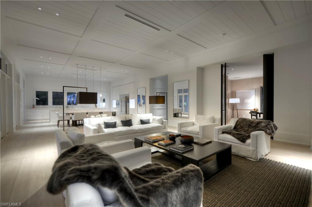1355 Nautilus Road Naples, FL 34102 - Photo 11 of 24 a living room with furniture and a flat screen tv