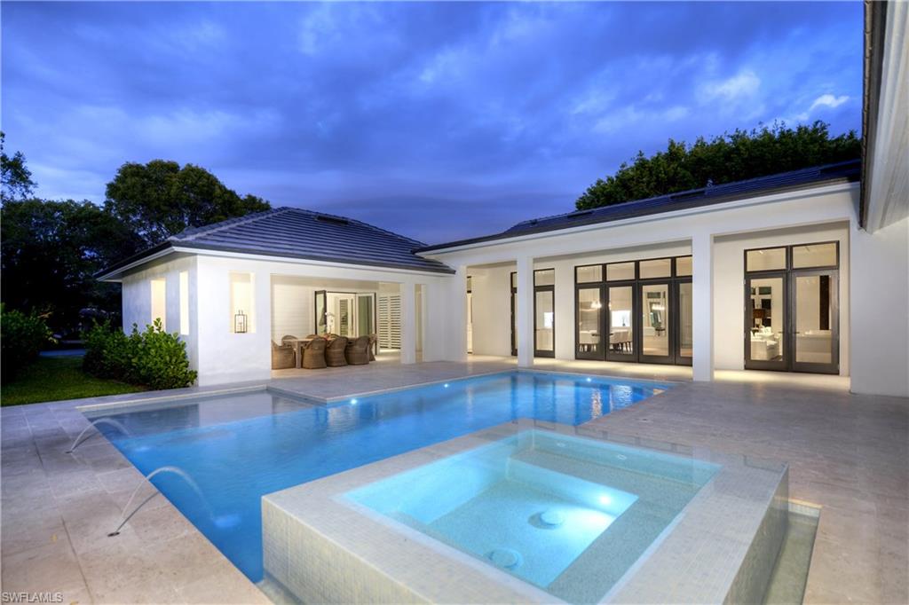 1355 Nautilus Road Naples, FL 34102 - Photo 2 of 24 a view of pool with seating area