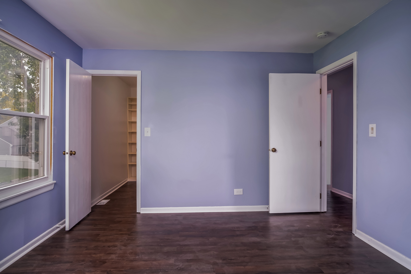 2860 Bridgeport Lane Aurora, IL 60504 - Photo 17 of 19 a view of an empty room with wooden floor and a window