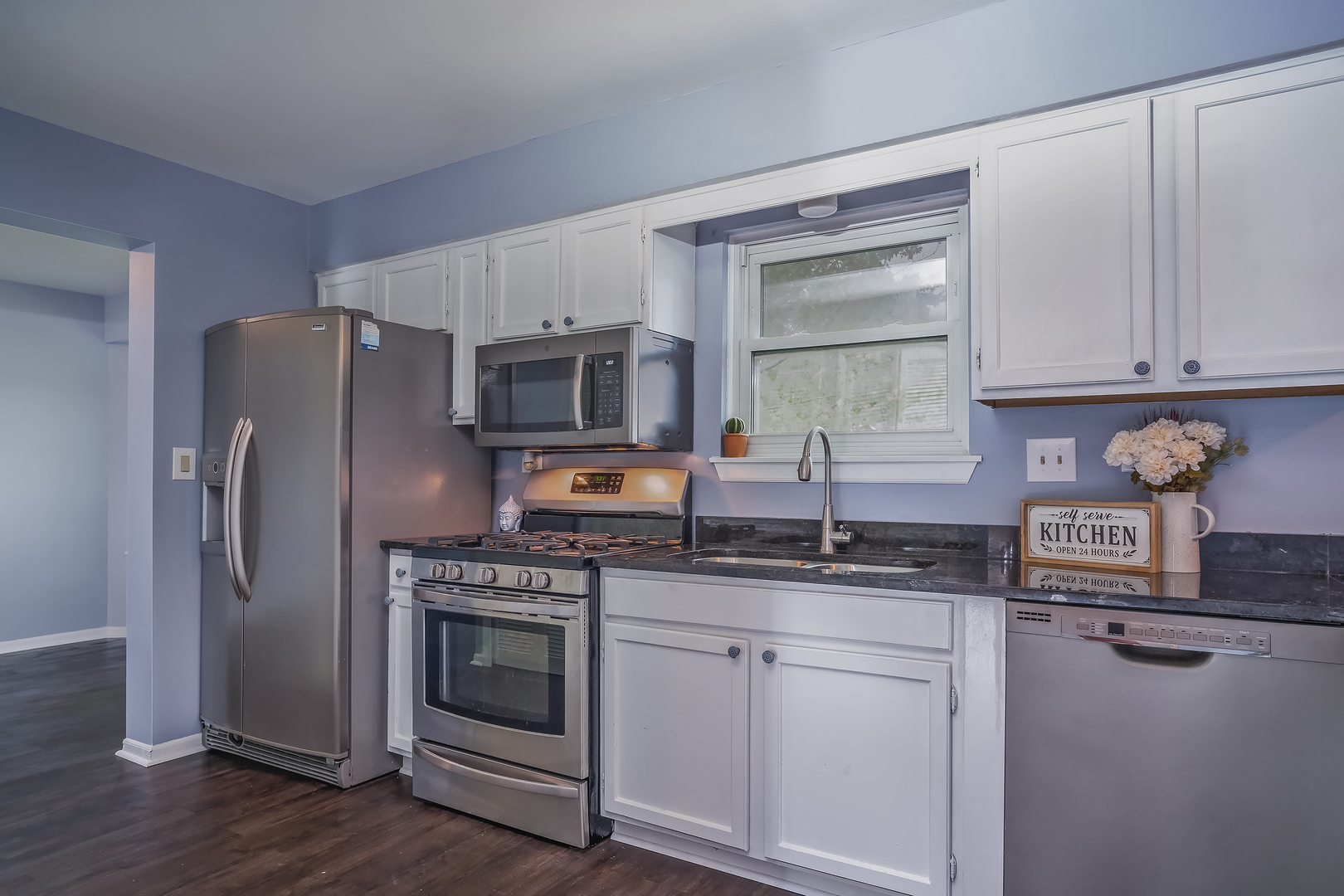 2860 Bridgeport Lane Aurora, IL 60504 - Photo 4 of 19 a kitchen with stainless steel appliances granite countertop a stove a sink and a refrigerator