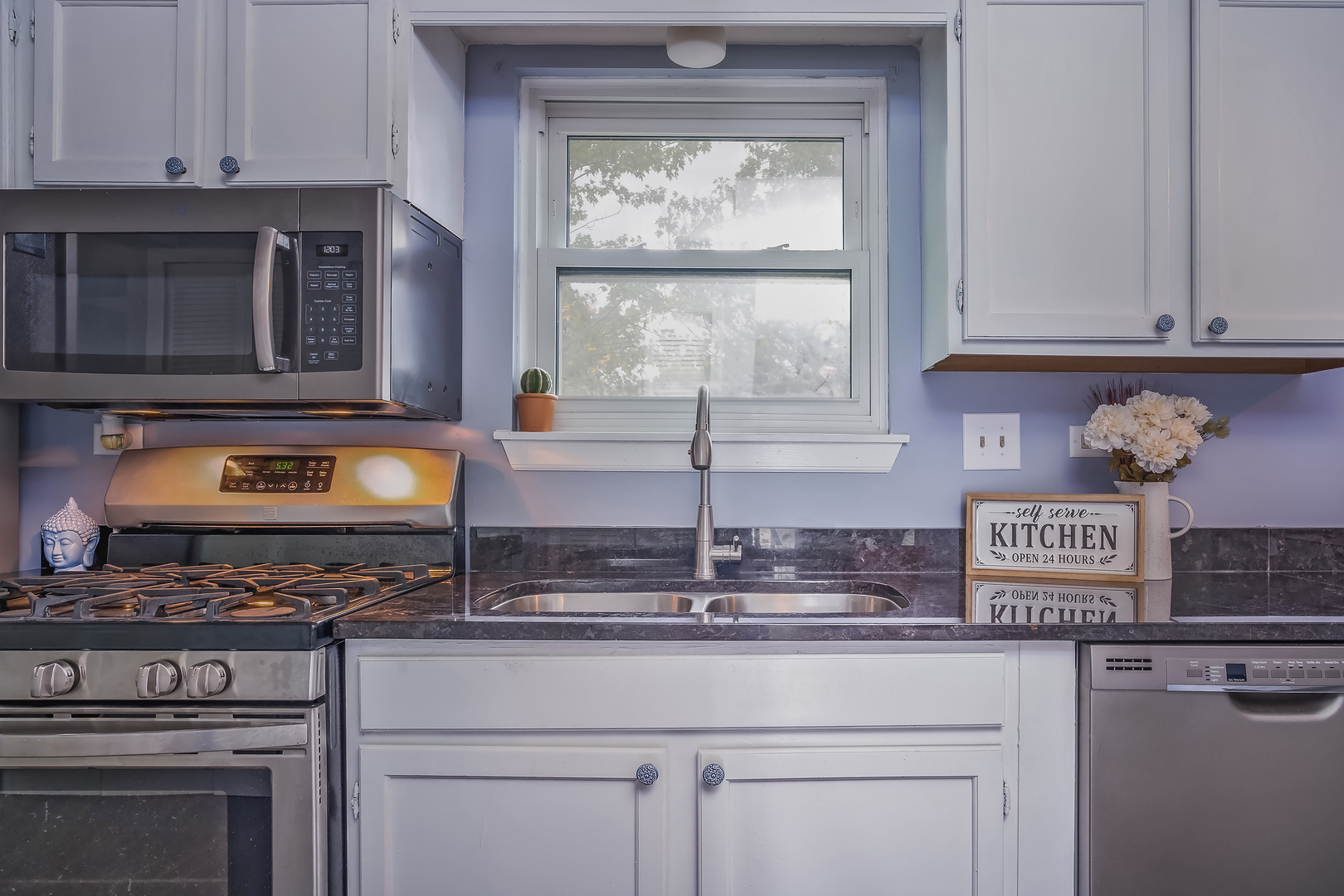 2860 Bridgeport Lane Aurora, IL 60504 - Photo 5 of 19 a kitchen with stainless steel appliances granite countertop white cabinets and a stove top oven