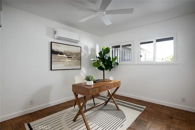 a workspace with furniture and a potted plant