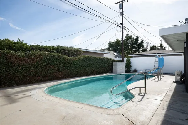 a view of a backyard with sitting area