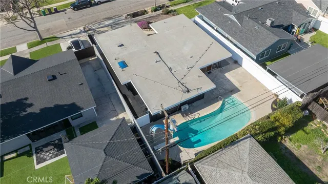 an aerial view of a house with a patio
