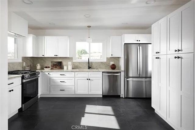 a kitchen with a refrigerator stove and white cabinets