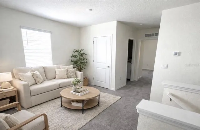 a bathroom with a double vanity sink toilet mirror and bathtub