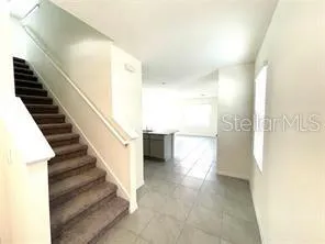 a view of an empty room and a window