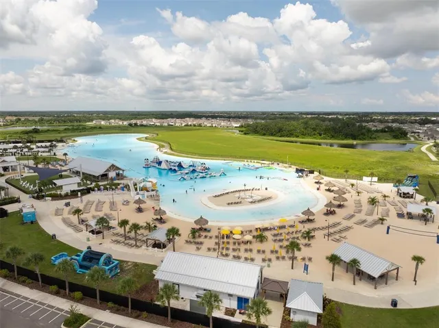 a view of a swimming pool with a lake view