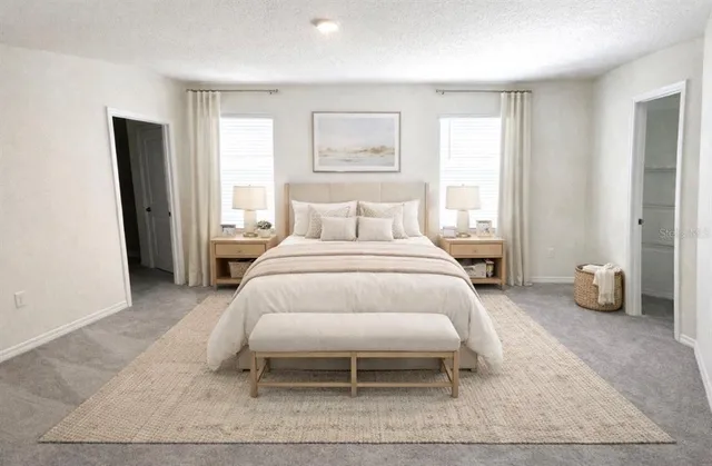 a bedroom with bed and a window