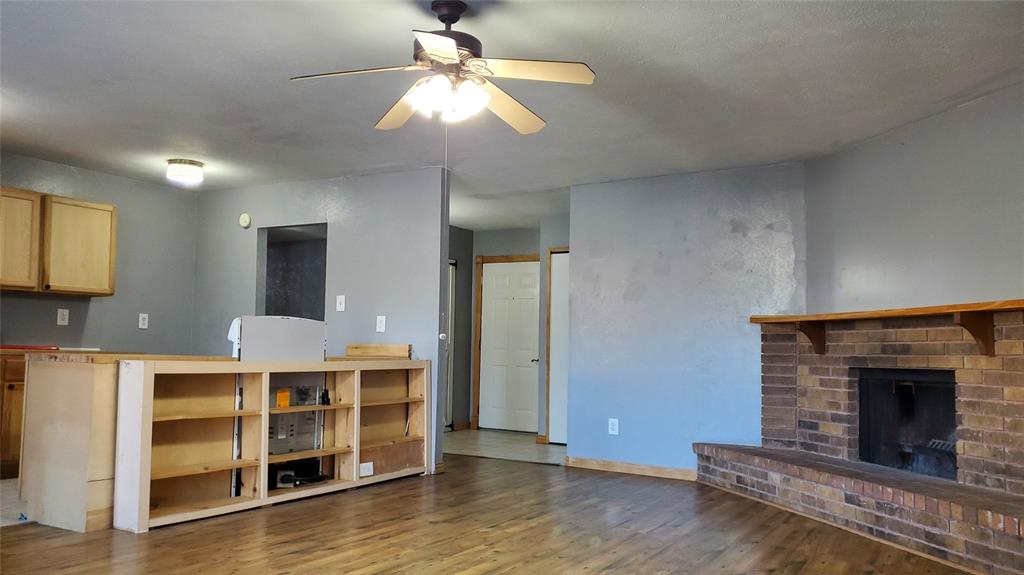 5724 Phelps Street The Colony, TX 75056 - Photo 2 of 11 a view of a livingroom with a fireplace
