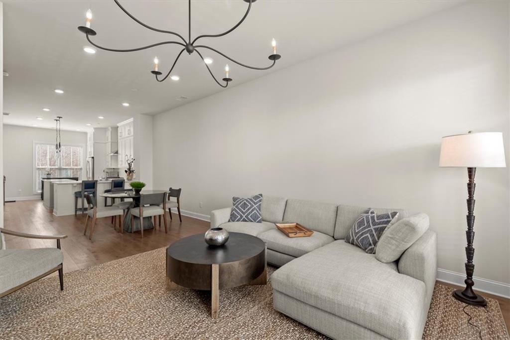 4217 Deming Circle Atlanta, GA 30342 - Photo 13 of 36 a living room with furniture and a chandelier